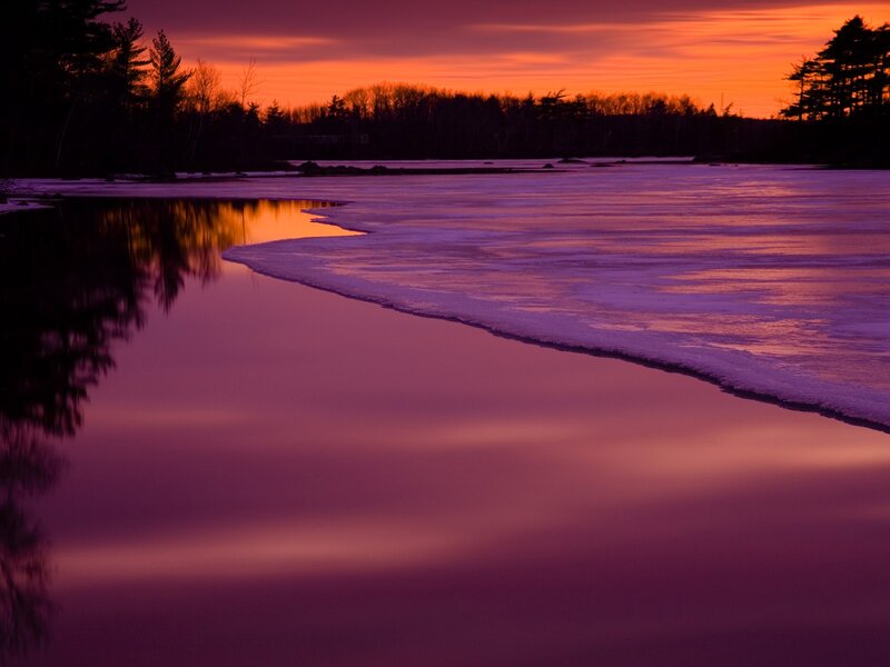 Purple sunset over frozen lake