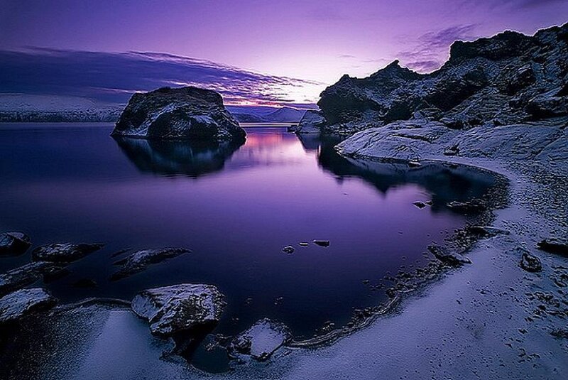 Purple sunset over icy lake