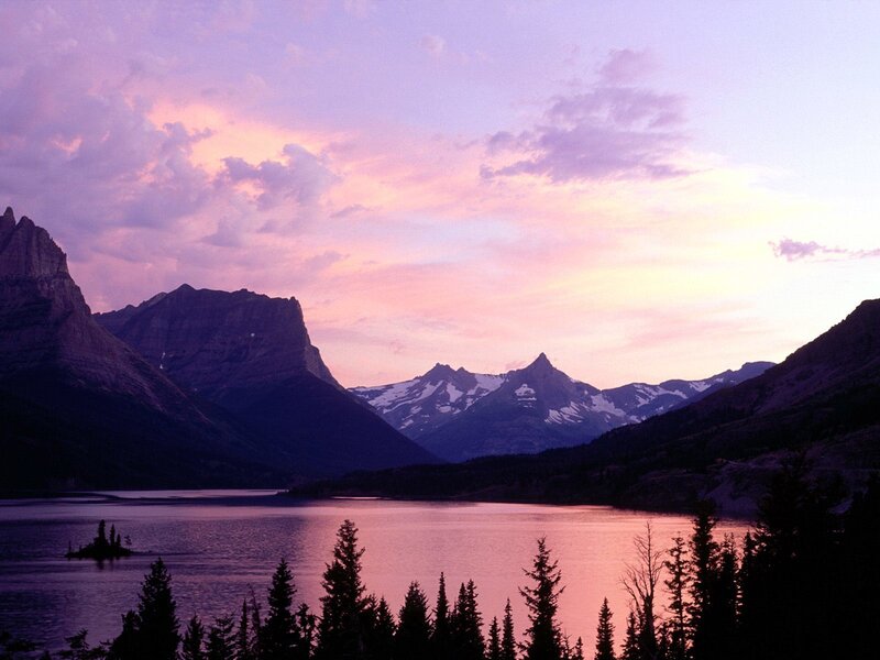 Purple sunset over mountain lake