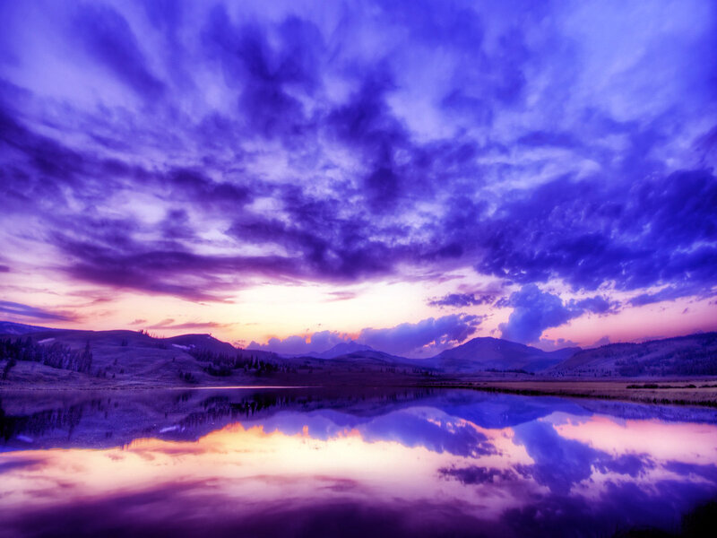 Purple sunset over mountain lake
