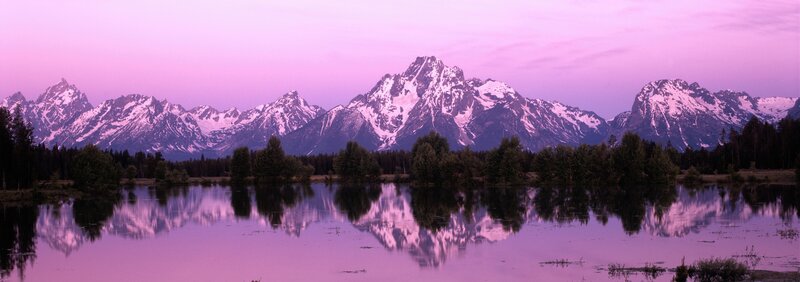 Purple sunset over mountain lake