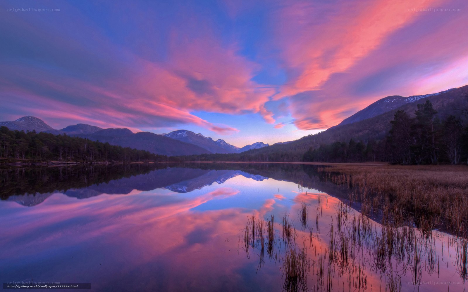 Purple sunset over mountain lake