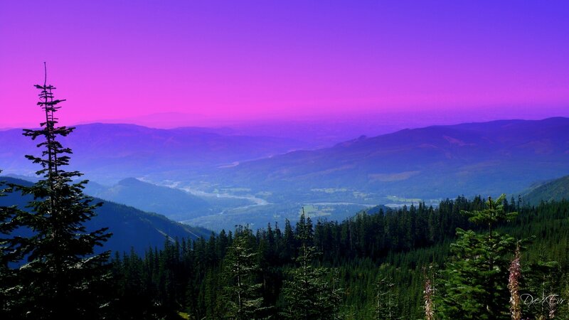 Purple sunset over mountain valley