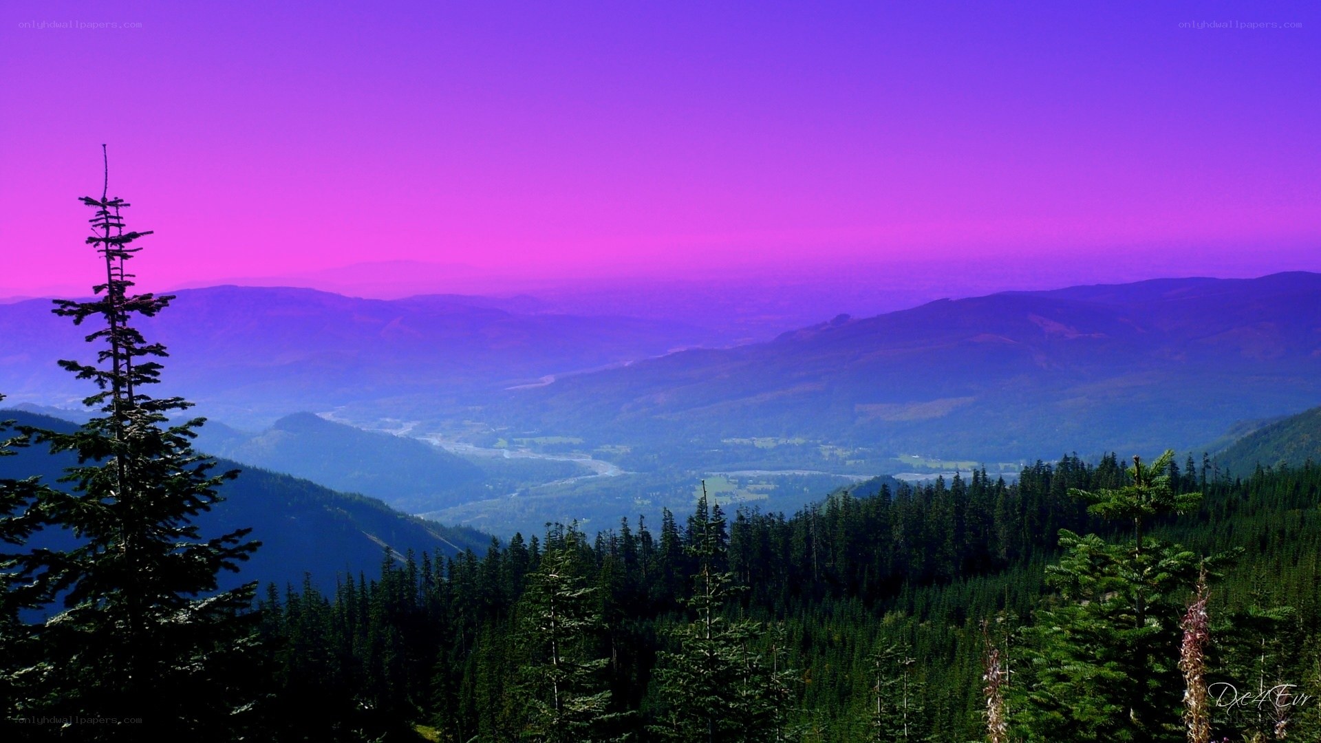 Purple sunset over mountain valley
