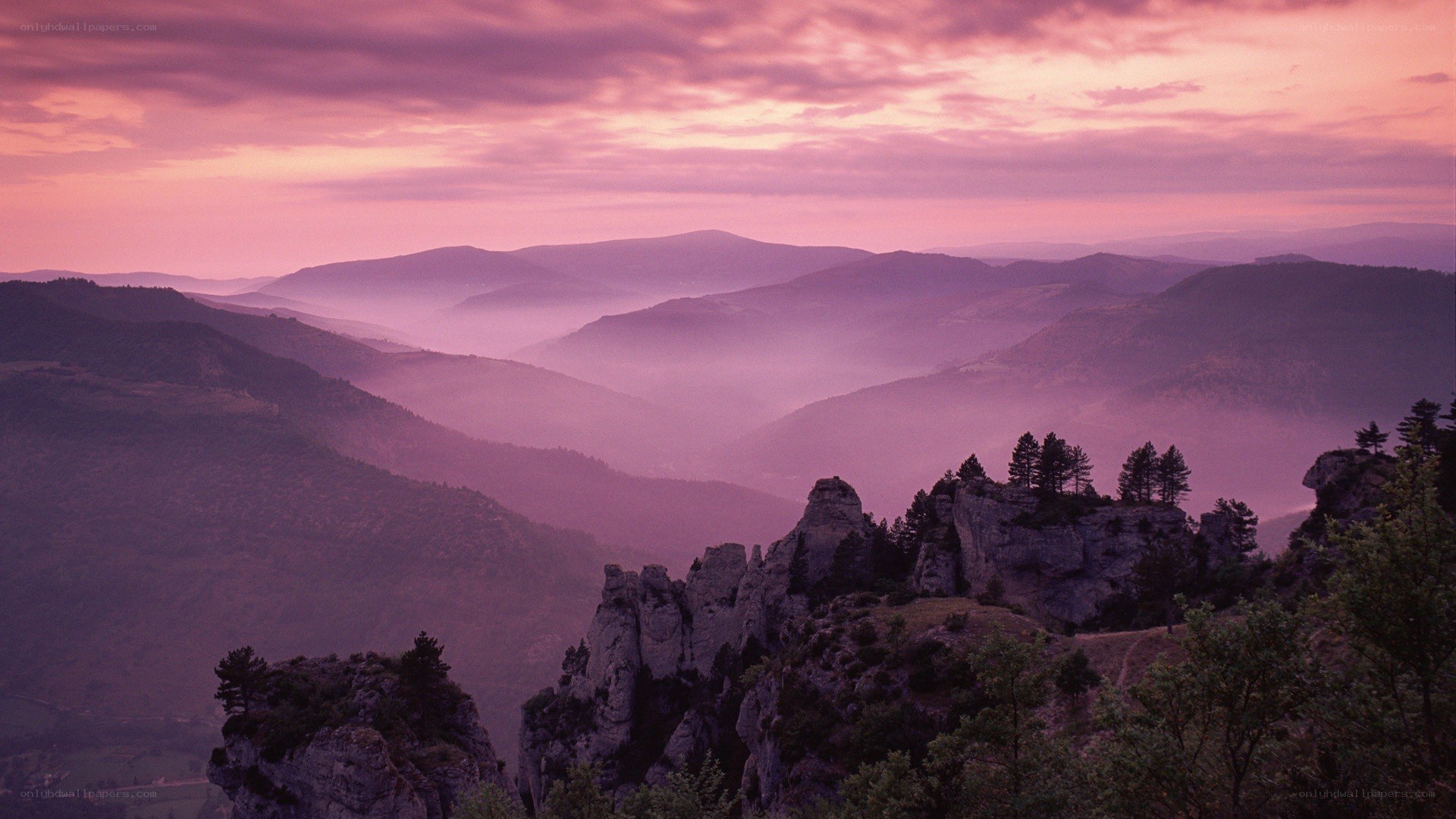 Purple sunset over mountain valleys