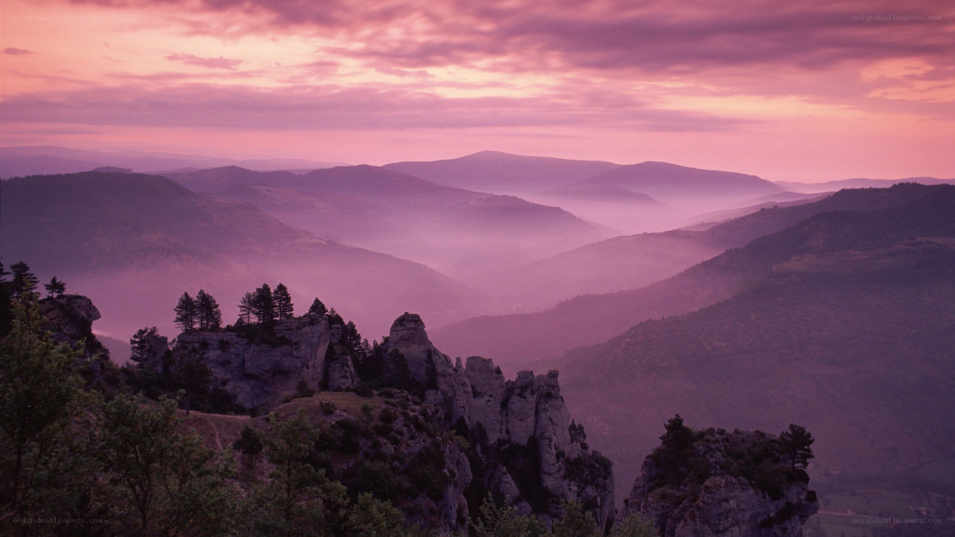 Purple sunset over mountain valleys