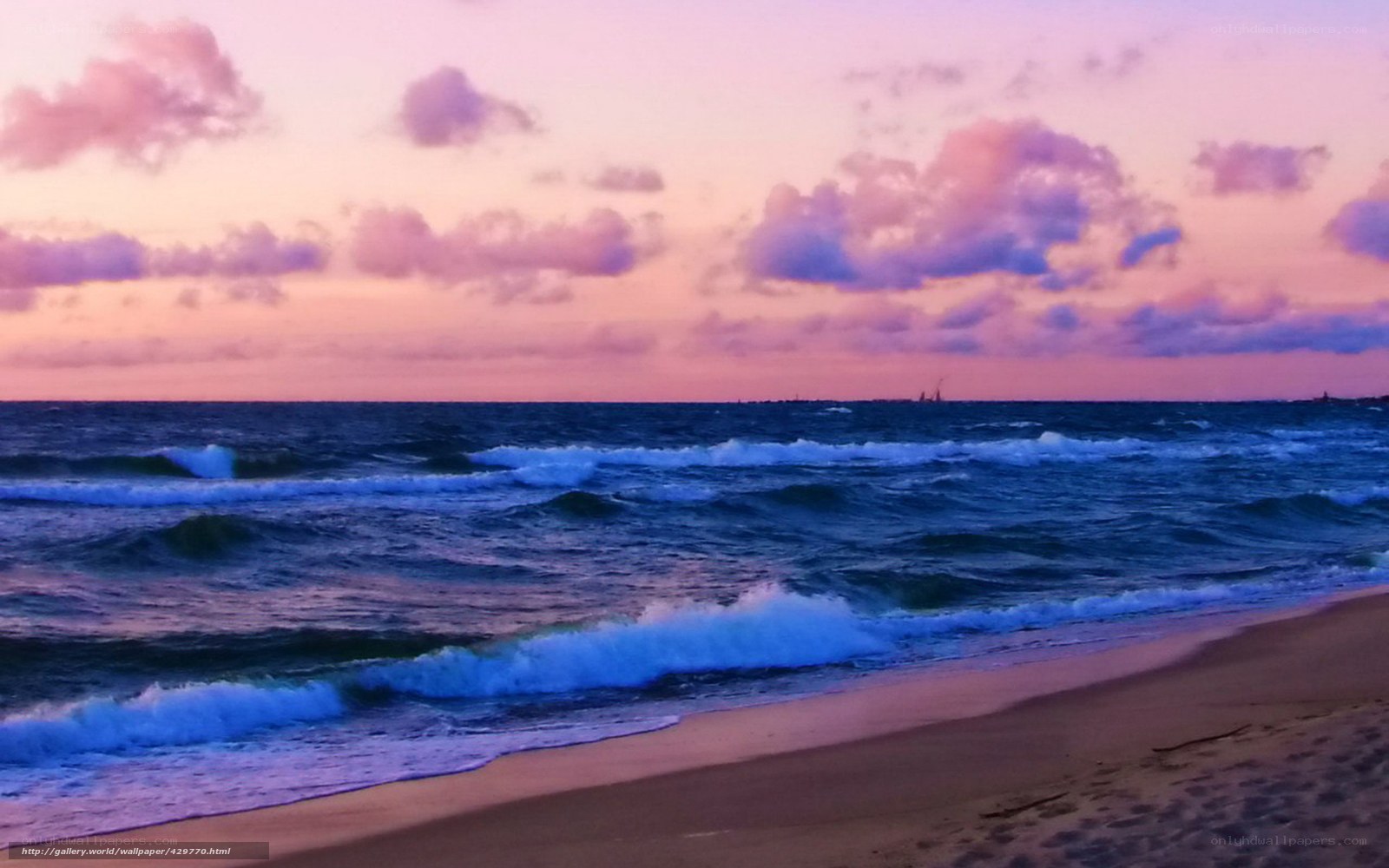Purple sunset over ocean waves