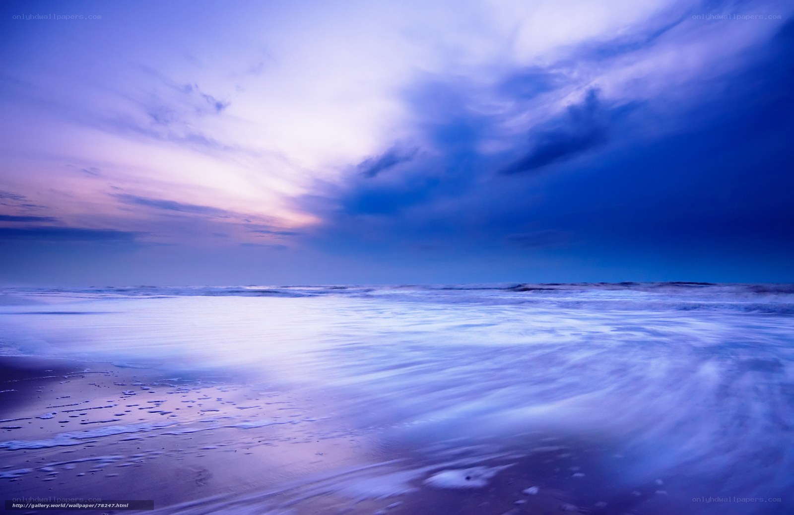 Purple sunset over ocean waves