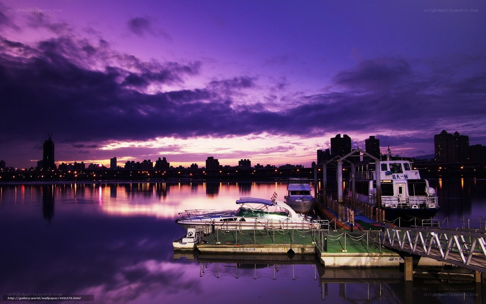 Purple sunset over river dock