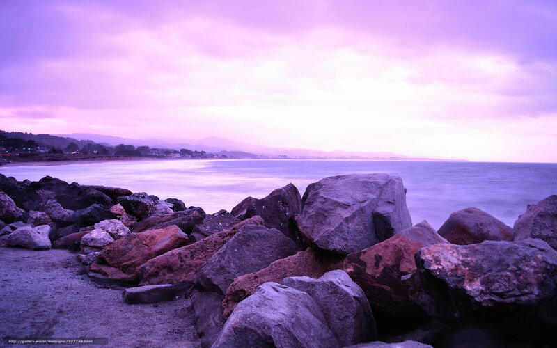 purple sunset over rocky shore
