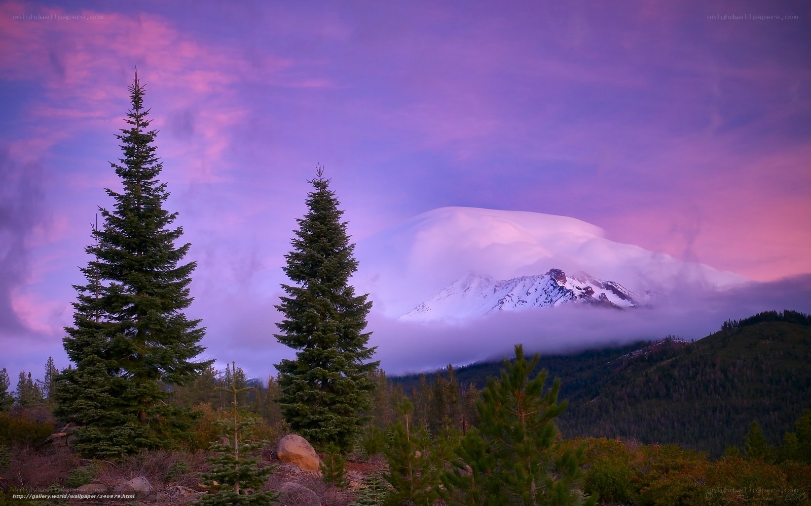 Purple sunset over snow-capped mountain