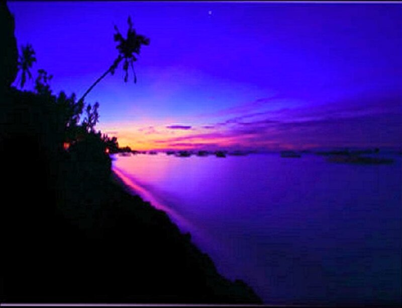 Purple sunset over tropical bay