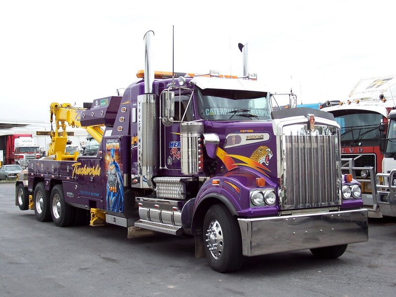 purple tow truck with crane
