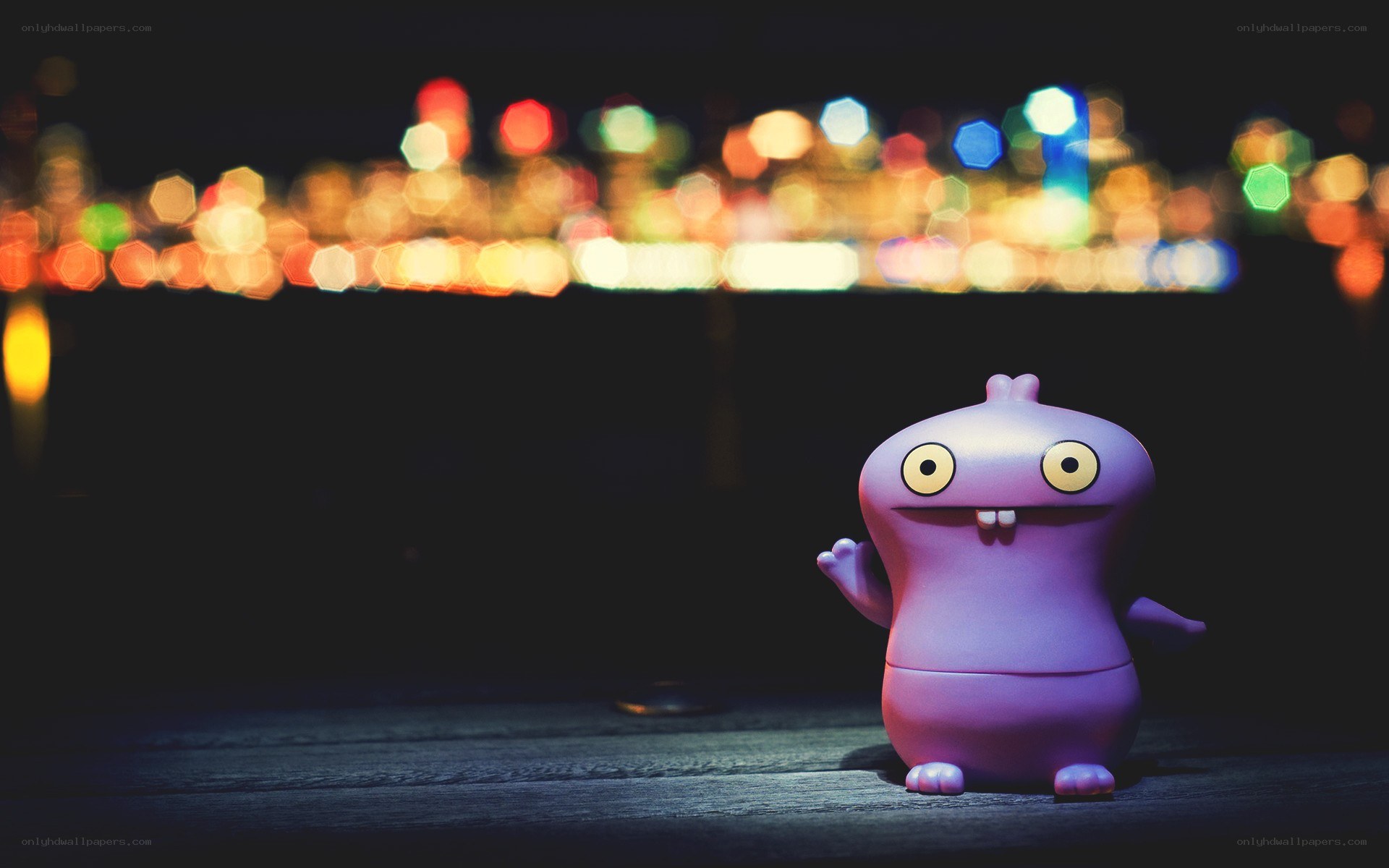 Purple toy figure at night