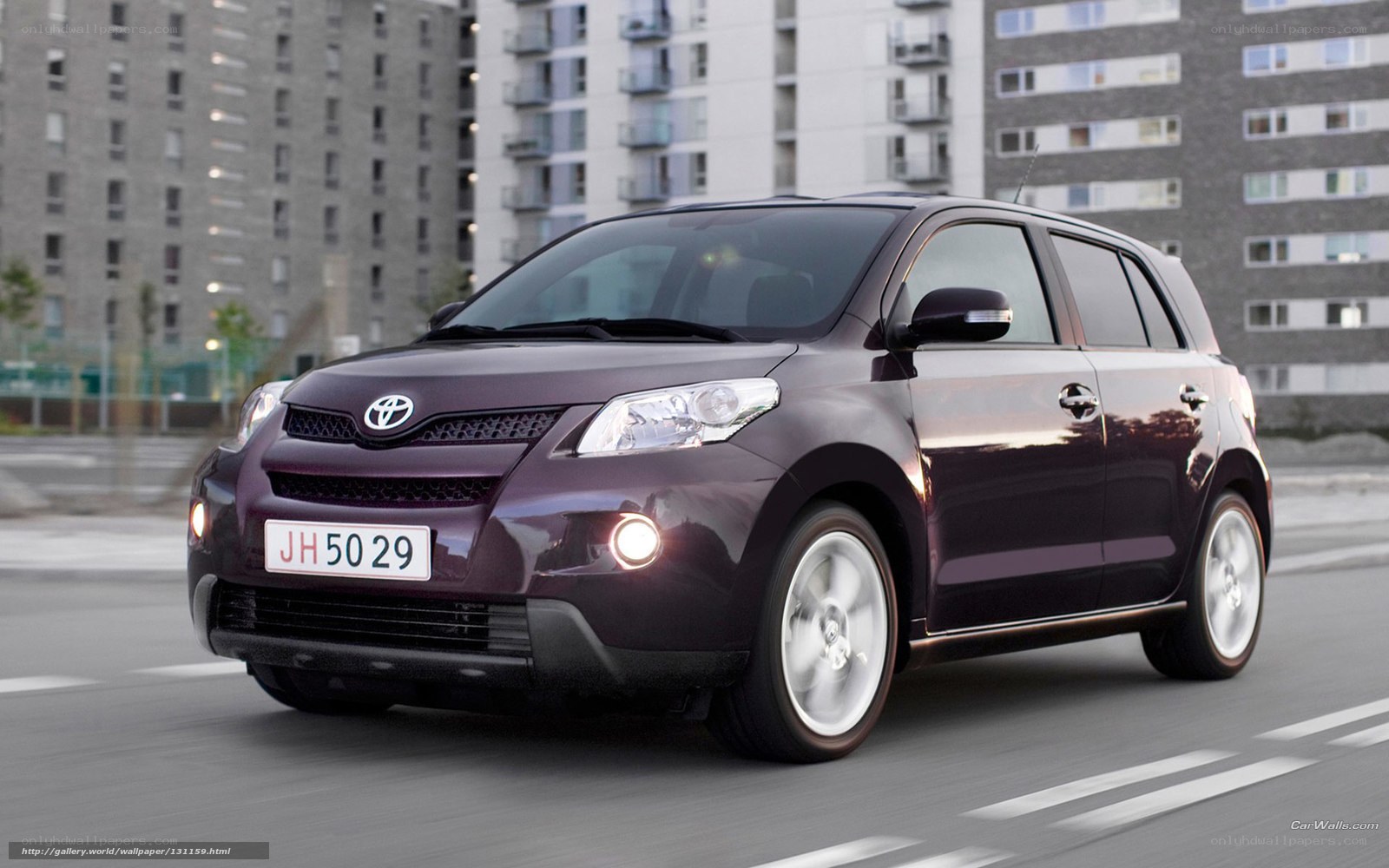 Purple Toyota Scion xD in city