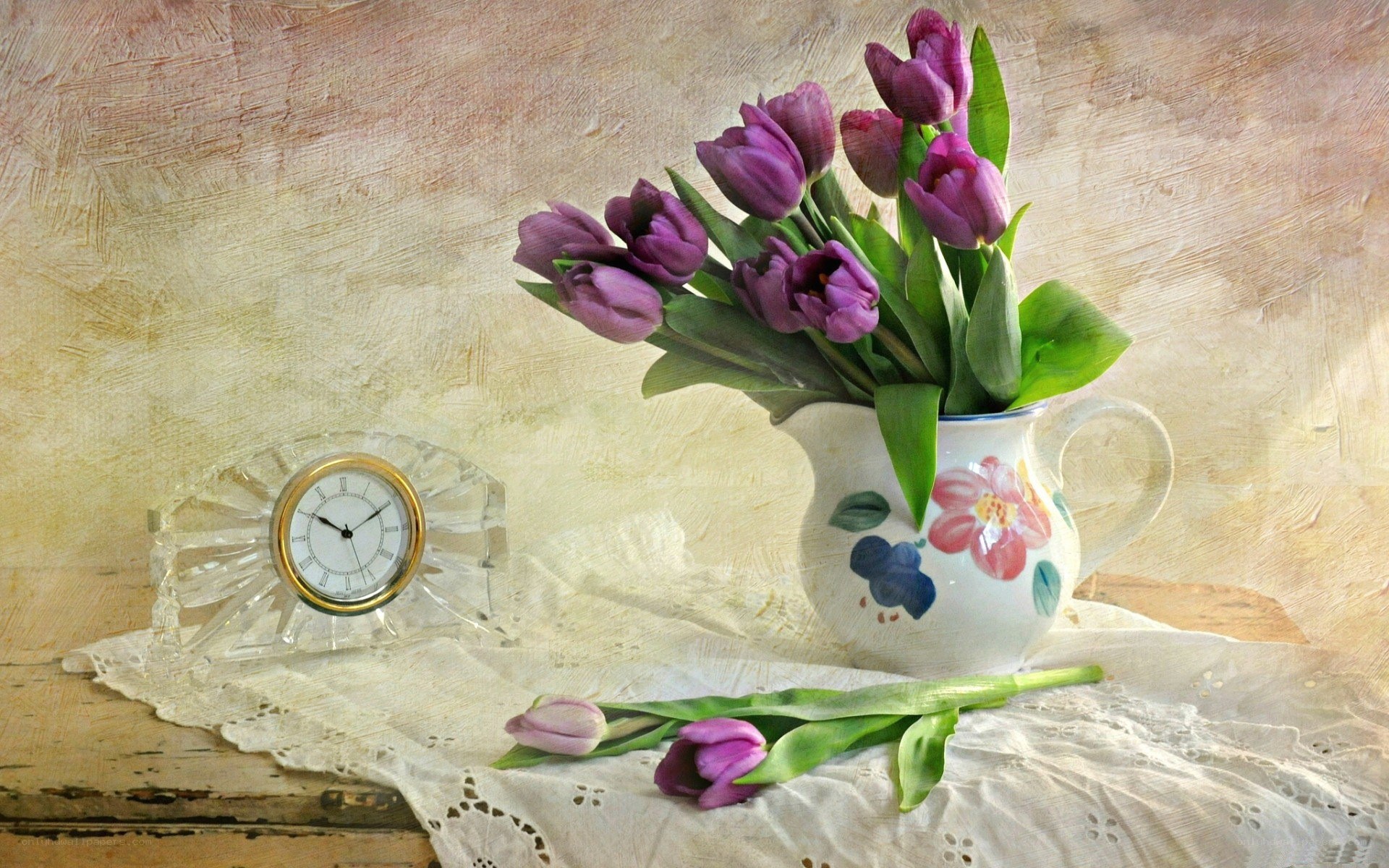 Purple tulips in a pitcher