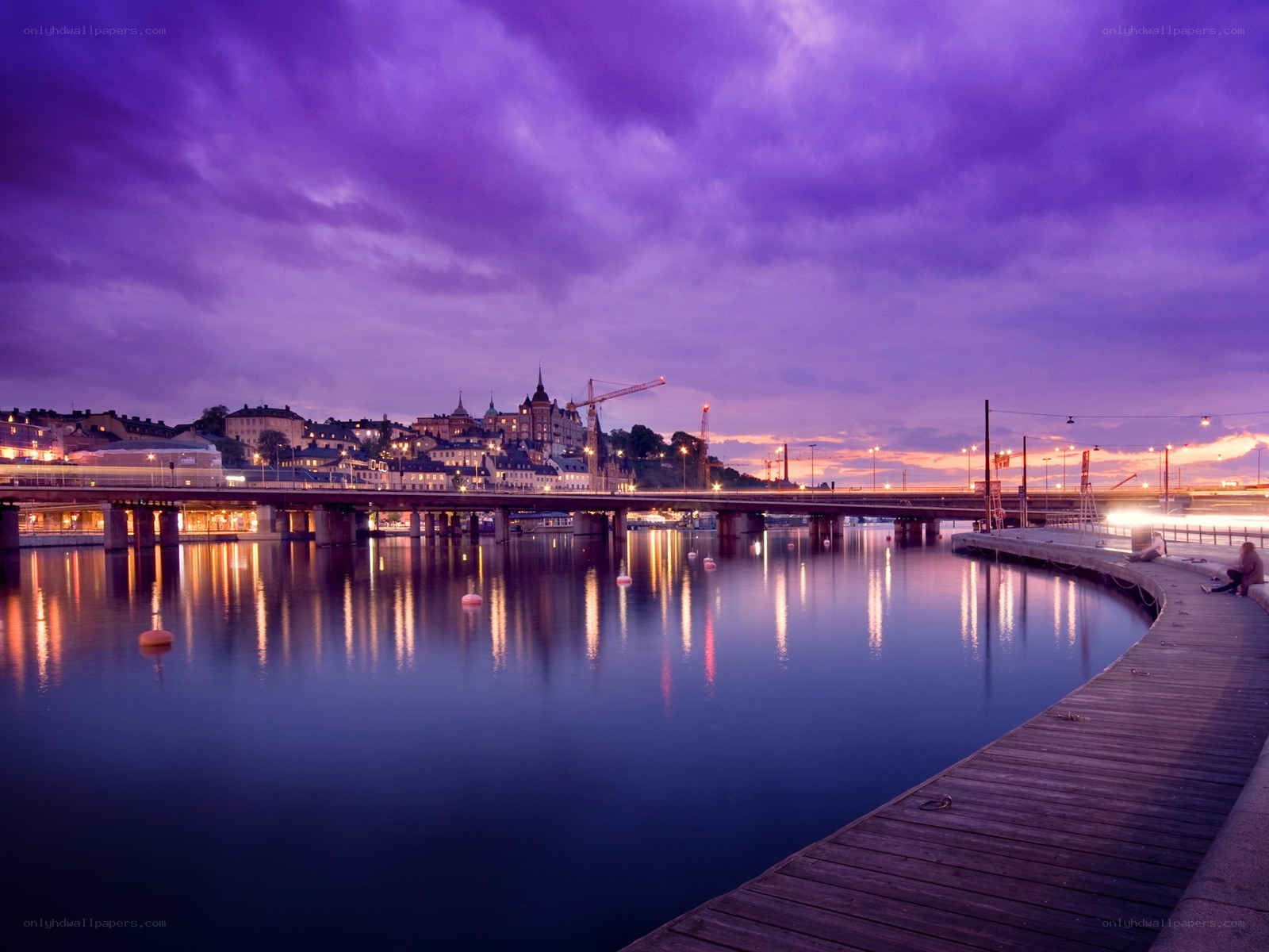 Purple twilight over a city harbor