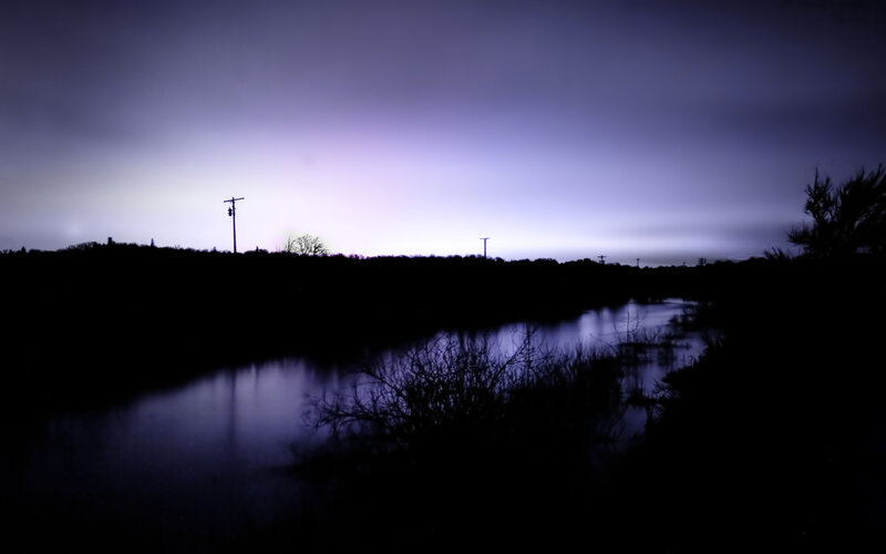 Purple twilight over a river