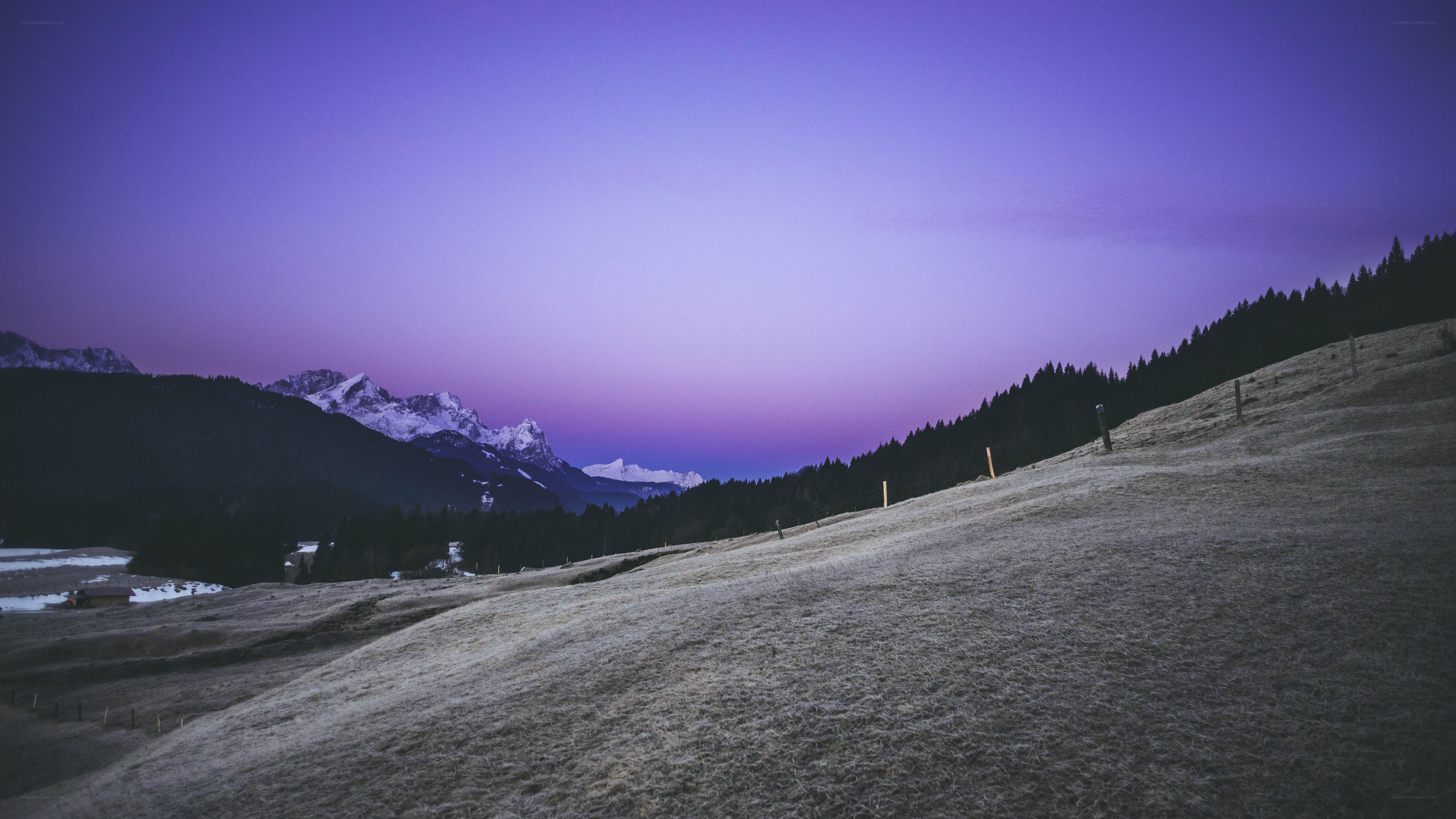 purple twilight over snowy mountains