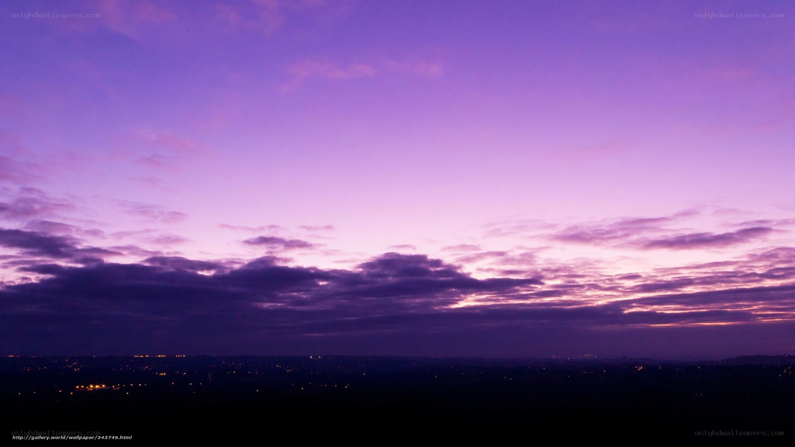 Purple twilight sky over city