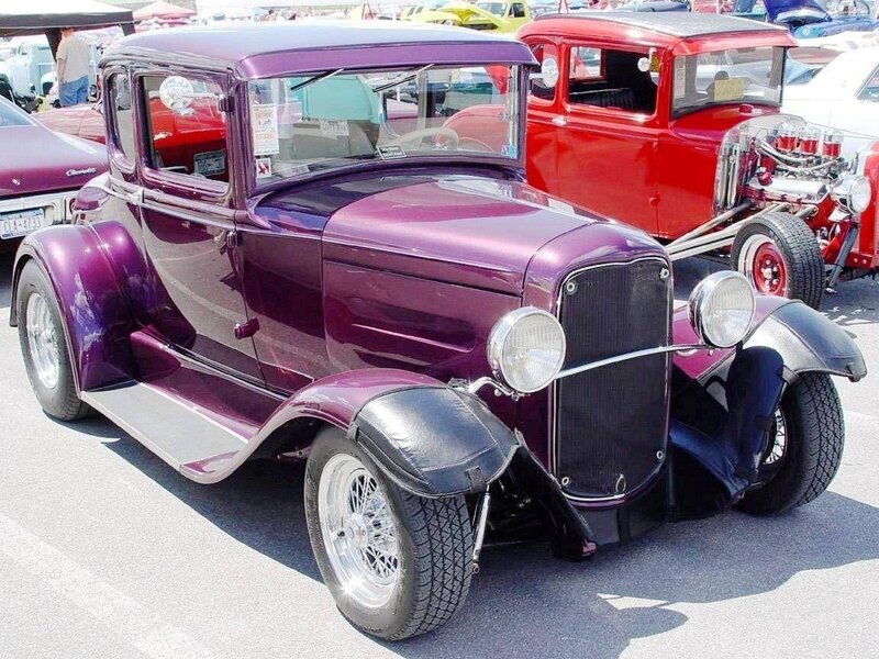 Purple vintage car at a show
