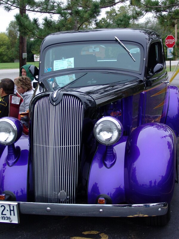 purple vintage car at a show