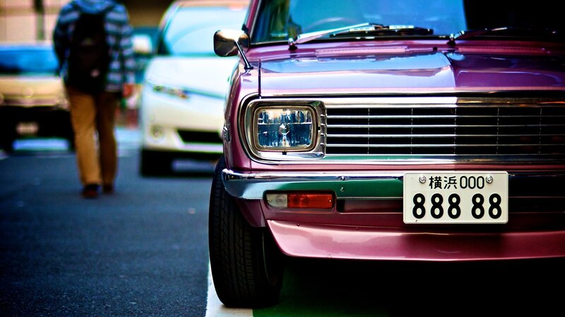 Purple vintage car in city