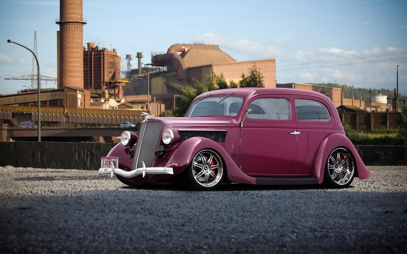 purple vintage car in industrial setting
