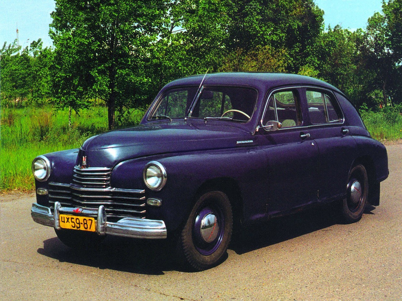 Purple vintage car on road