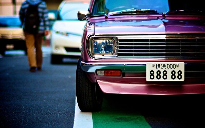 Purple vintage car on street