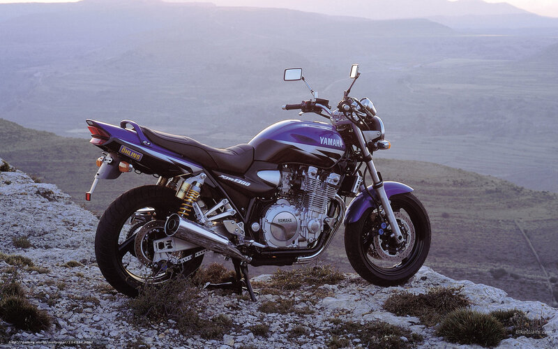 Purple Yamaha motorcycle on cliff