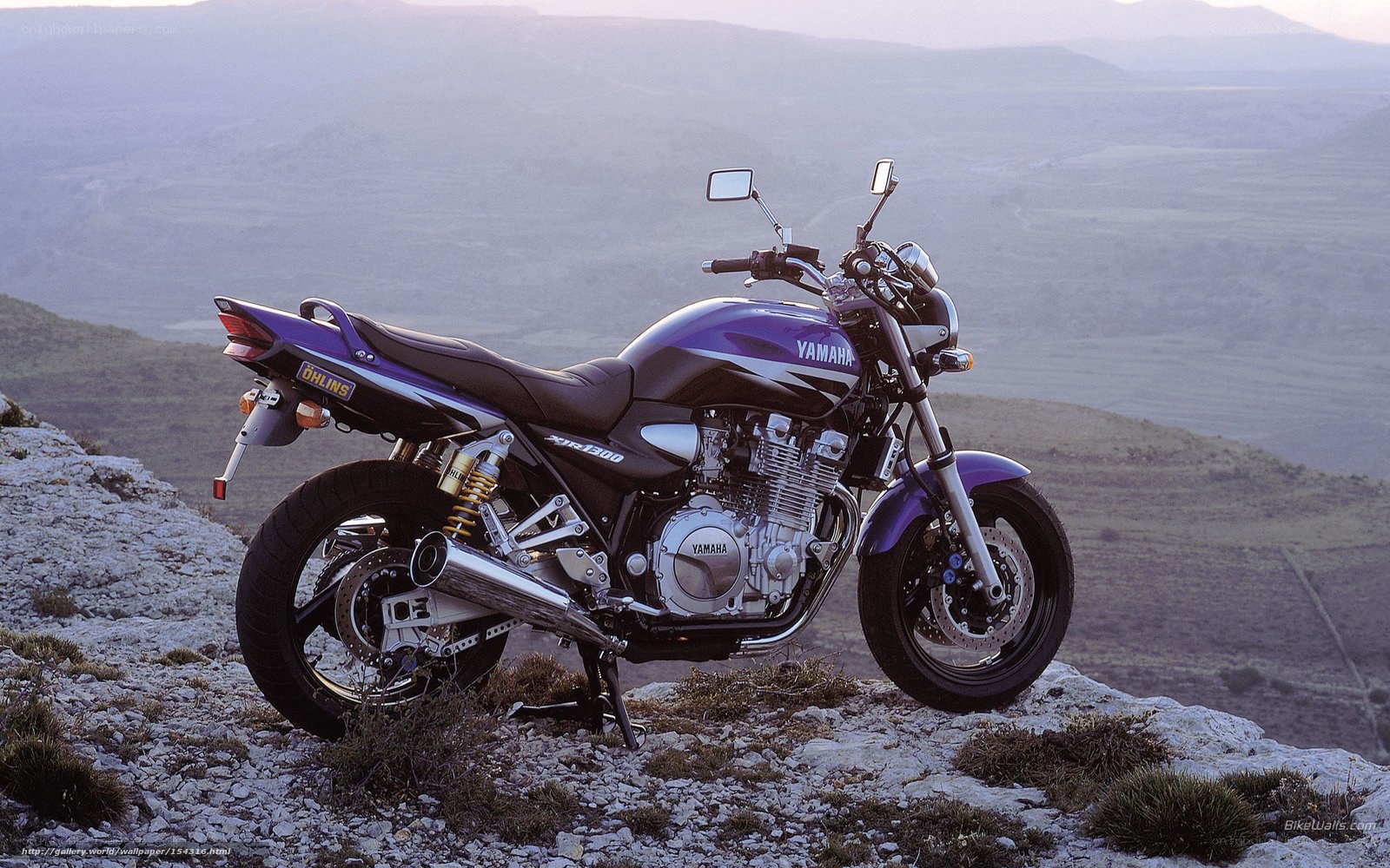 Purple Yamaha motorcycle on cliff