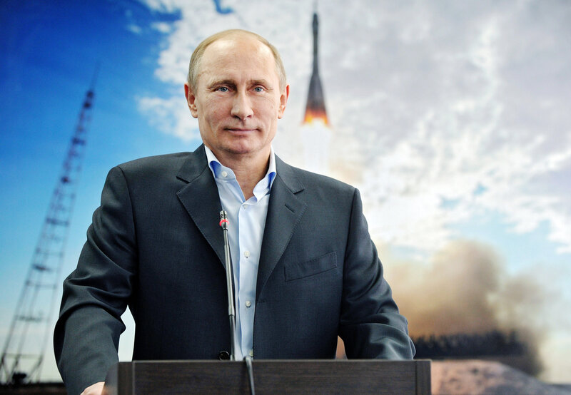 Putin at podium with rocket launch