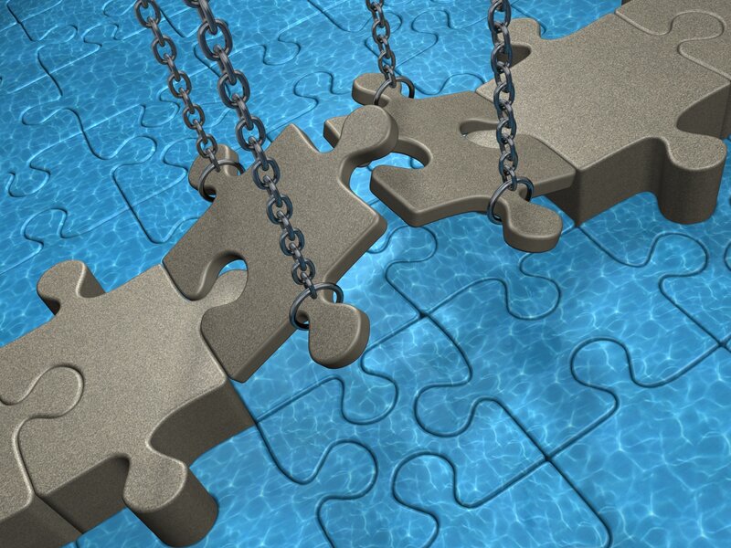 Puzzle pieces over water