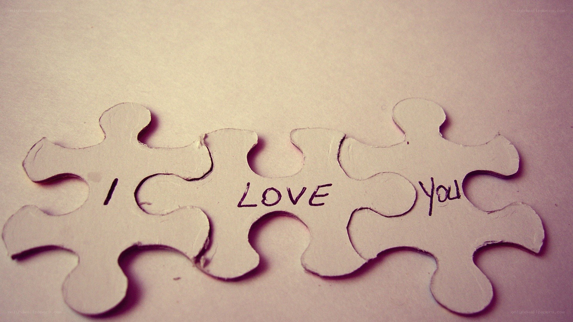puzzle pieces with 'i love you'
