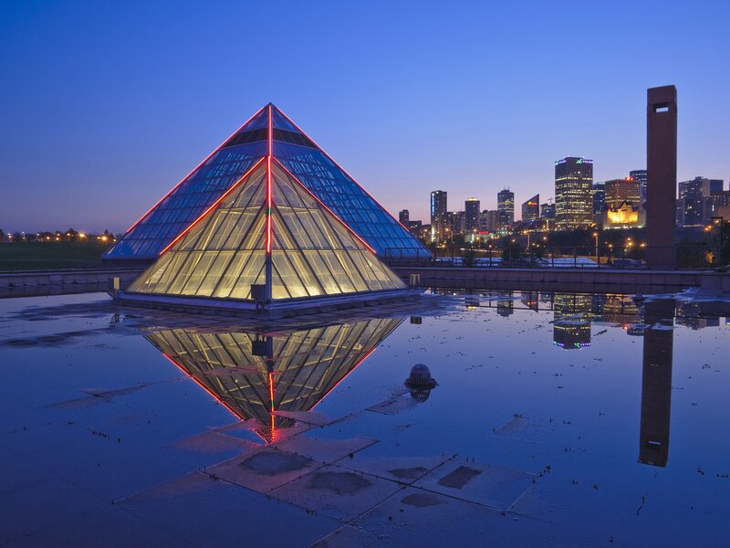 Pyramid at dusk with city skyline