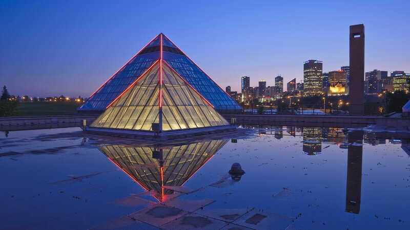 Pyramid at dusk with city skyline