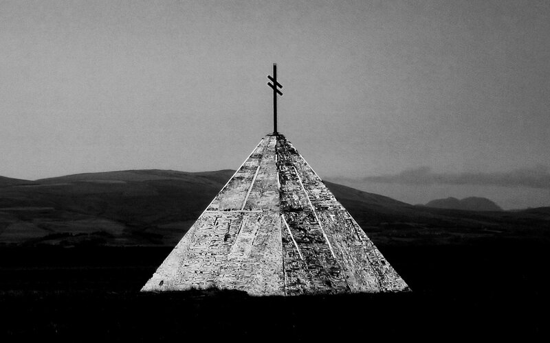 Pyramid monument with cross