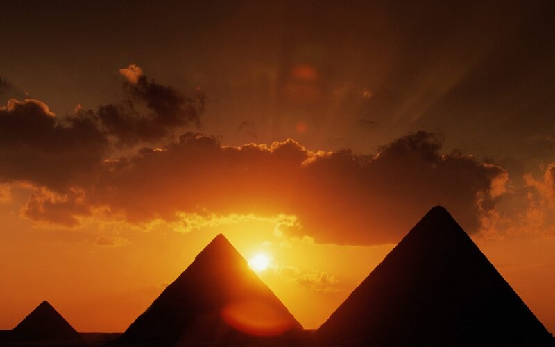 Pyramids at Sunset — Orange, Dramatic, Photograph, Sun, Clouds, Silhouette