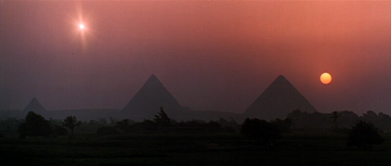 Pyramids at sunset with two suns