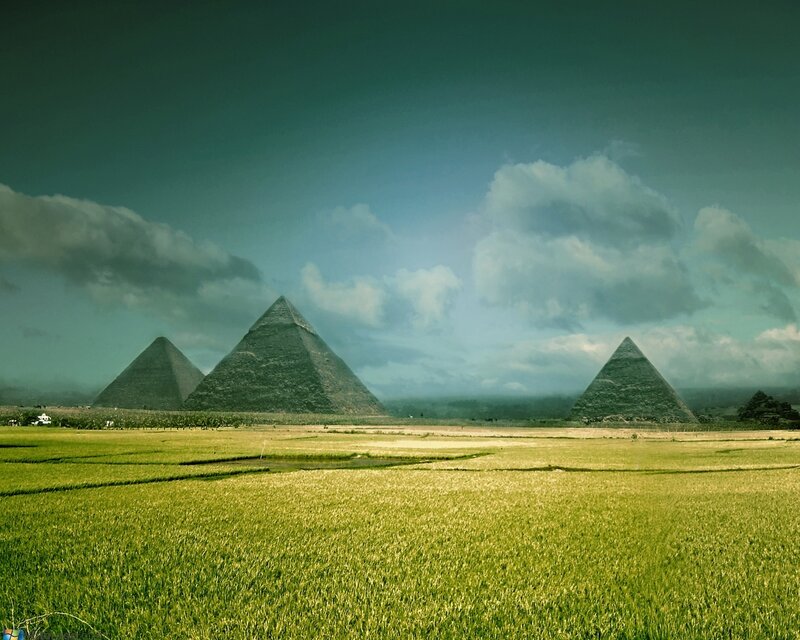 Pyramids in a green field
