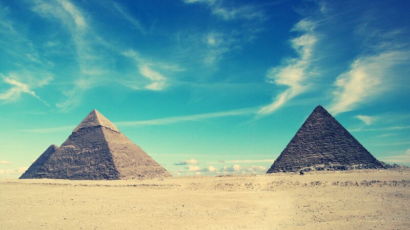Pyramids of Giza under blue sky