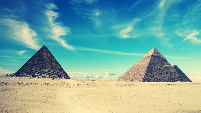 Pyramids of Giza under blue sky