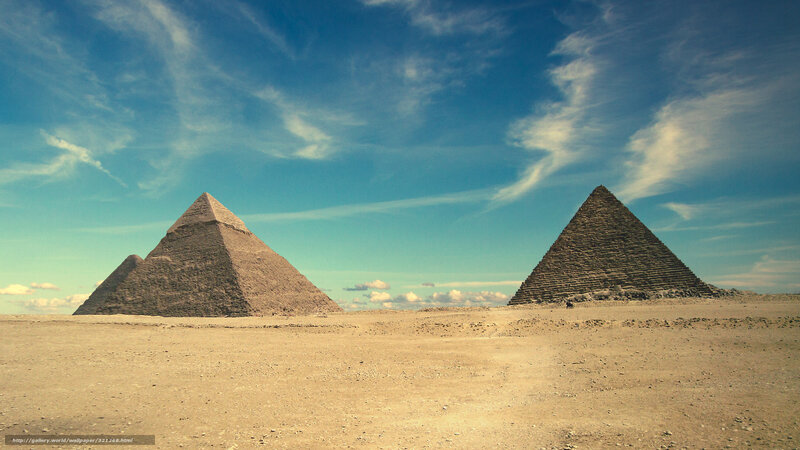 Pyramids of Giza under blue sky