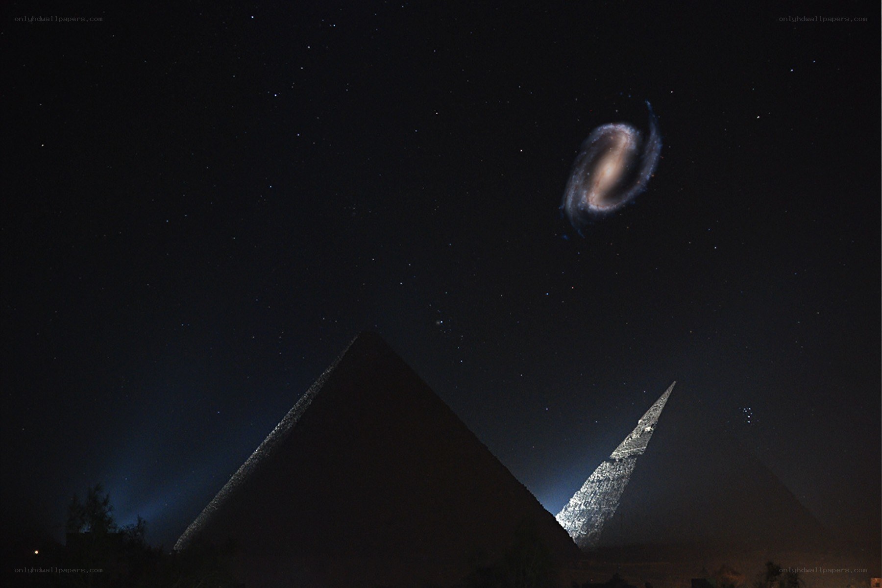 Pyramids under a galaxy sky