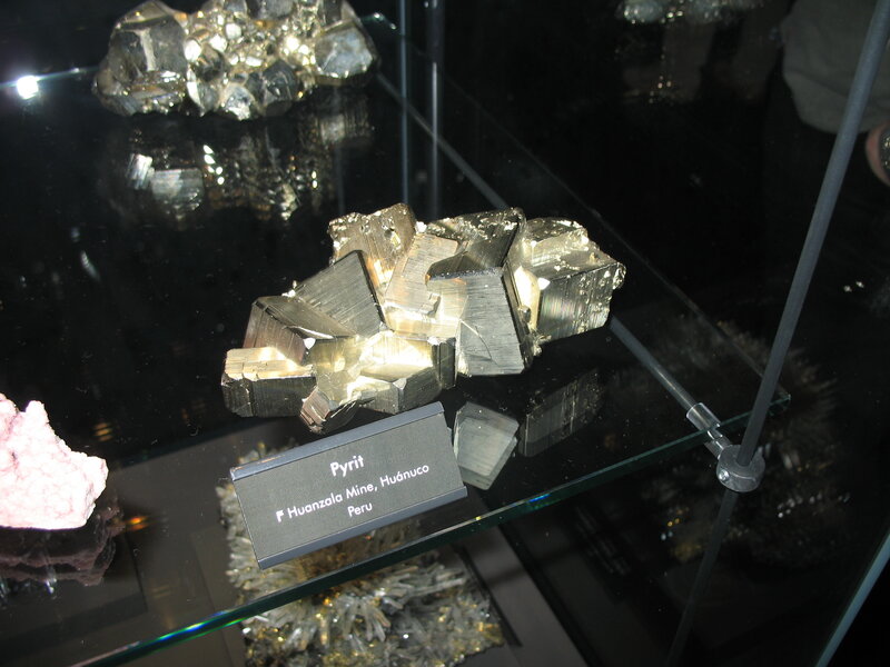 Pyrite specimen in display case