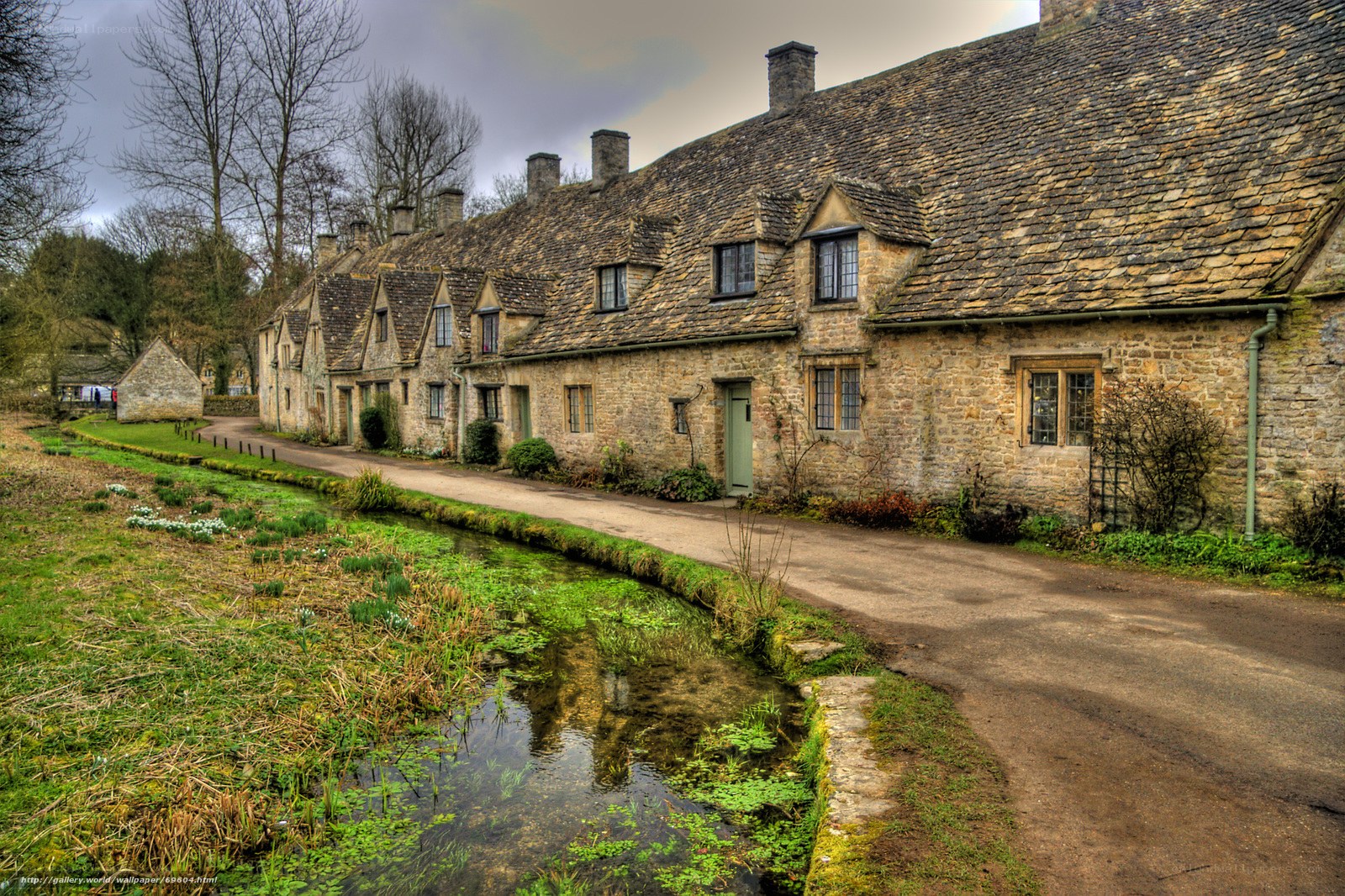 Quaint stone cottages by a stream