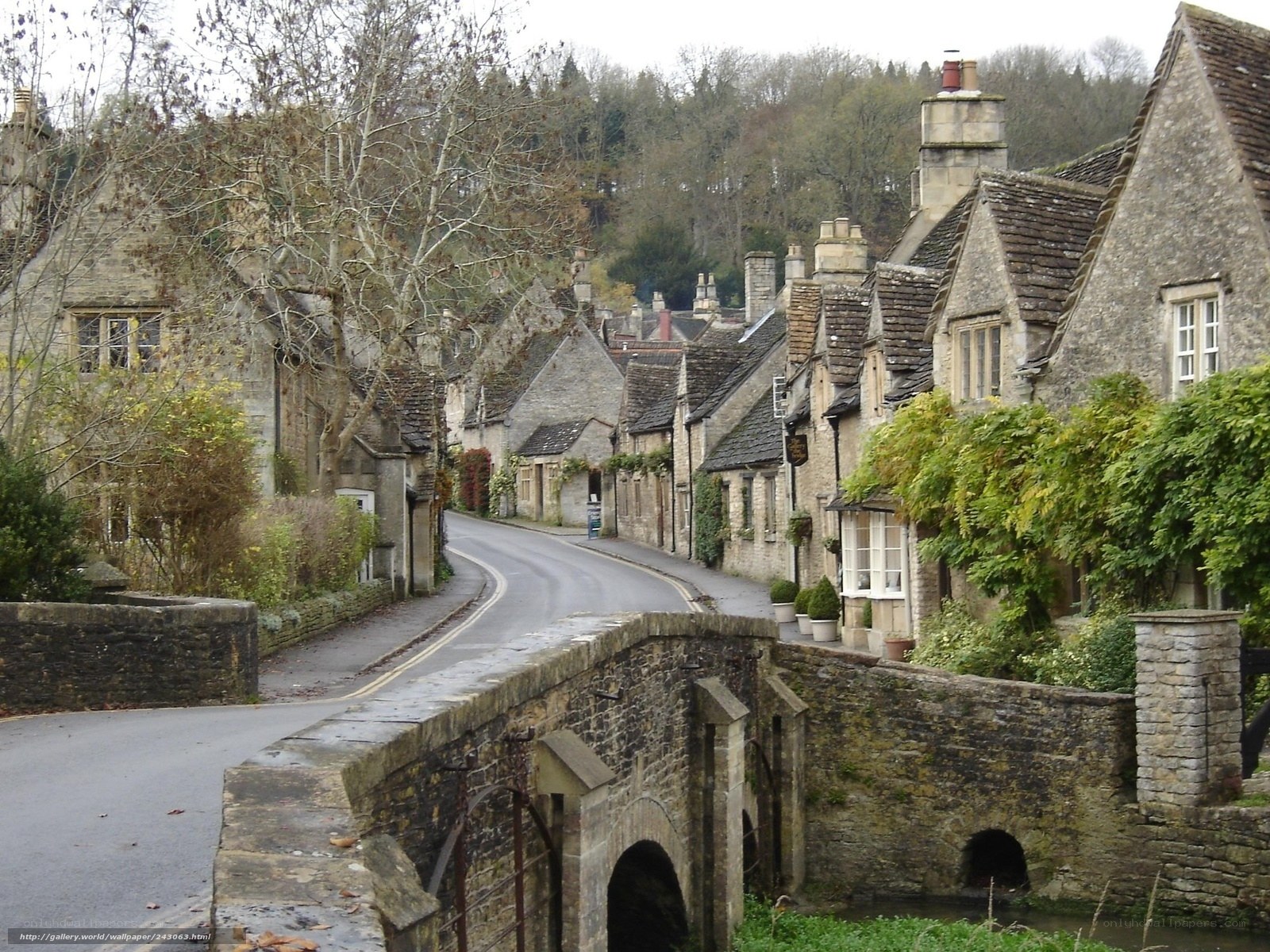 Quaint village street with stone bridge