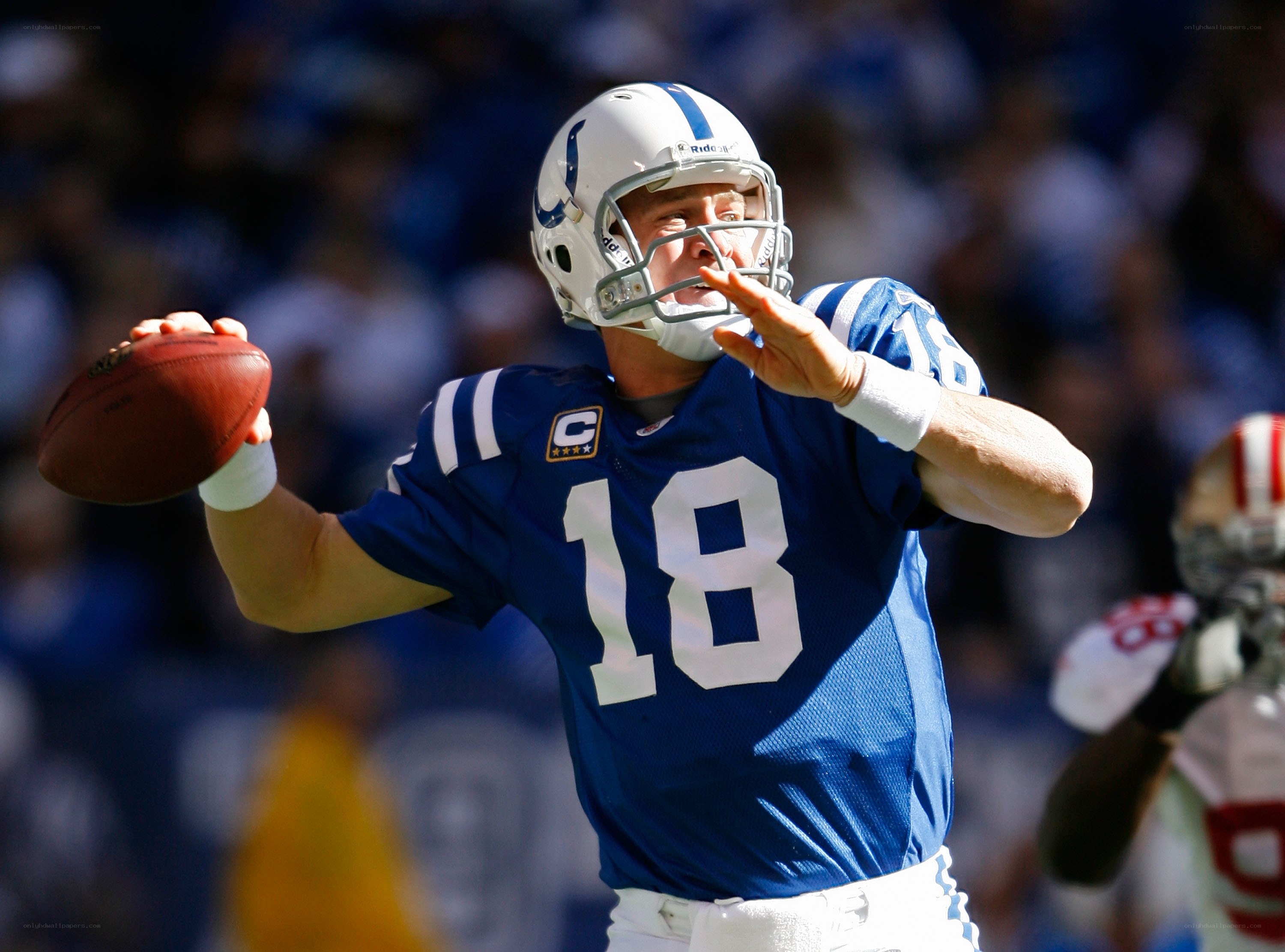 Quarterback throwing football
