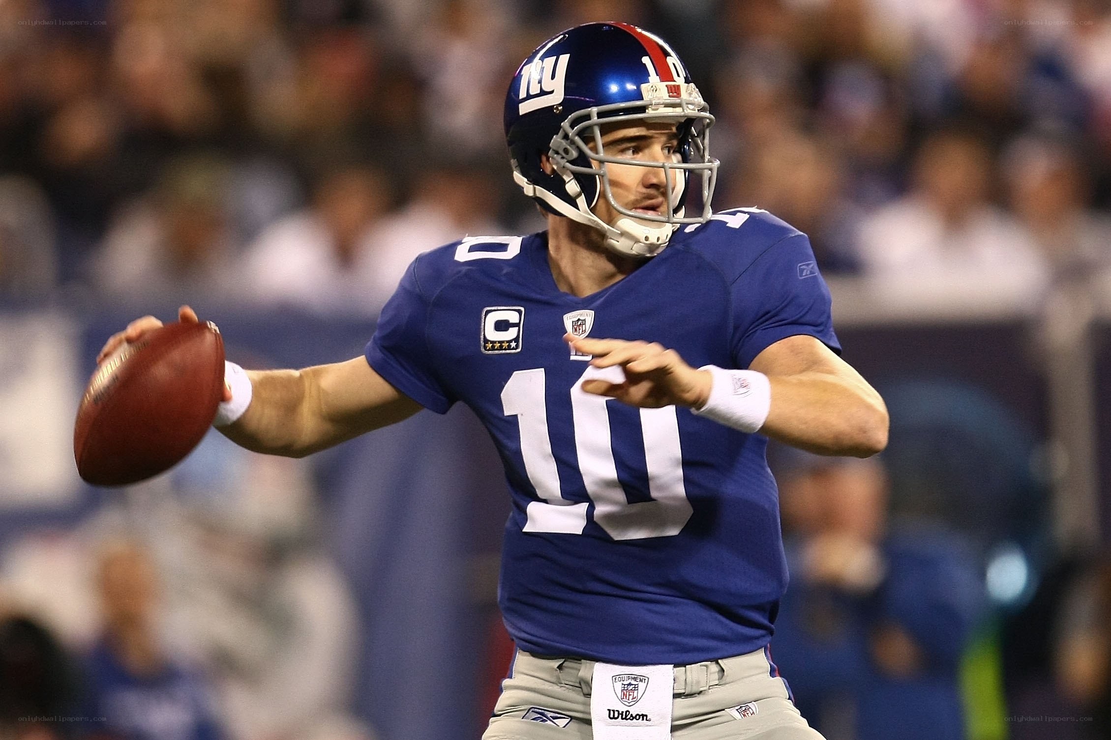 Quarterback throwing football